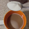 Stirring a scoop of Halal Tallow Collagen into a coffee, then the full Halal Tallow range